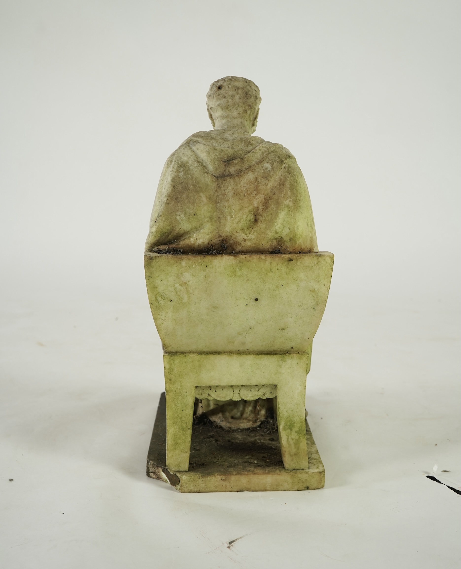 A marble sculpture of a gentleman dressed as a Greek philosopher, seated in a klismos chair, first half 19th century